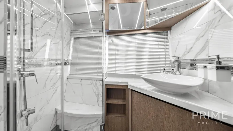  Yacht Photos Pics Luxurious bathroom in 2021 Galeon 680 Fly yacht with marble and modern fixtures.