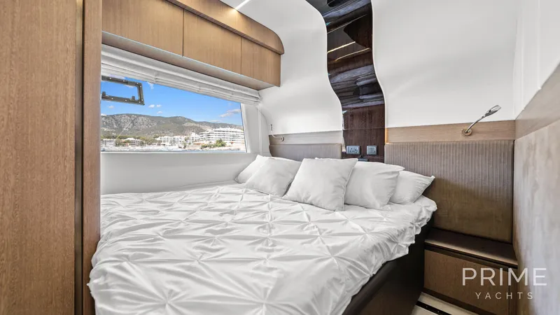  Yacht Photos Pics Luxurious bedroom interior of 2021 Galeon 680 Fly yacht with scenic window view.