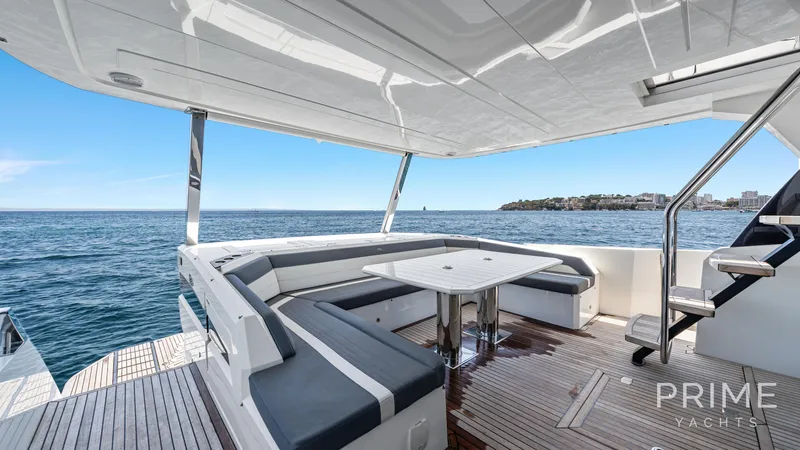  Yacht Photos Pics Luxurious 2021 Galeon 680 Fly yacht deck with ocean view and elegant seating area.