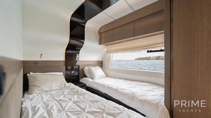  Yacht Photos Pics Interior of 2021 Galeon 680 Fly yacht cabin with twin beds and ocean view.