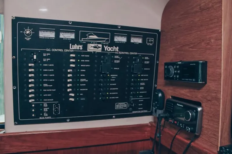  Yacht Photos Pics Control panel of a 1993 Luhrs 350 Tournament yacht with various switches and gauges.