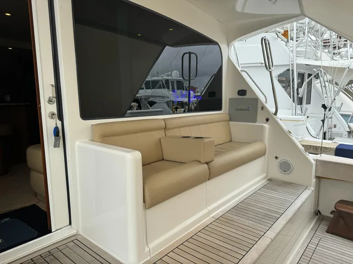  Yacht Photos Pics 2010 Viking 54 Convertible yacht with beige seating on the deck.