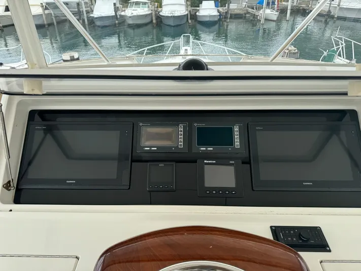  Yacht Photos Pics Control panel of a 2010 Viking 54 Convertible yacht with navigation screens.