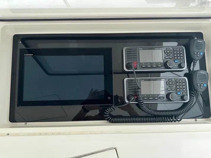  Yacht Photos Pics Control panel of a 2010 Viking 54 Convertible yacht with navigation and communication equipment.