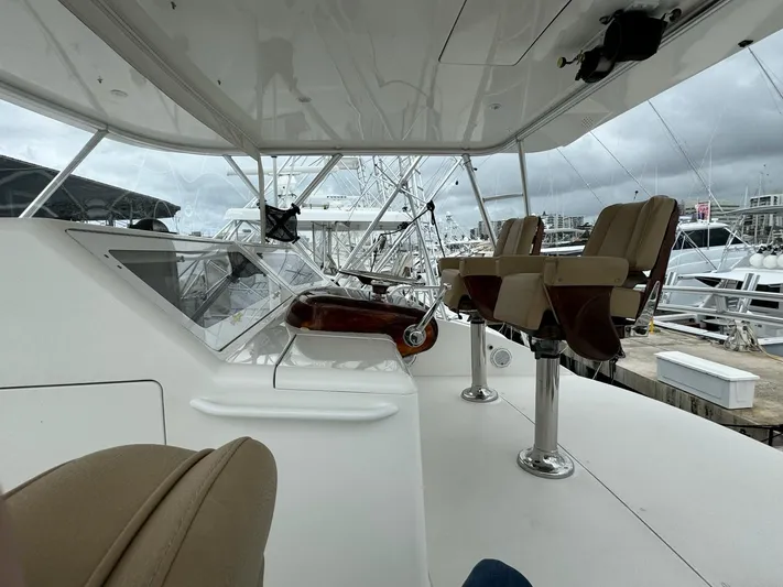  Yacht Photos Pics 2010 Viking 54 Convertible yacht helm station with dual captain chairs at marina.