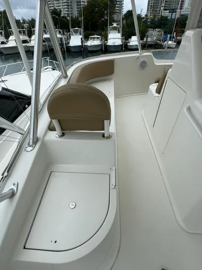  Yacht Photos Pics 2010 Viking 54 Convertible boat deck with seating and storage.