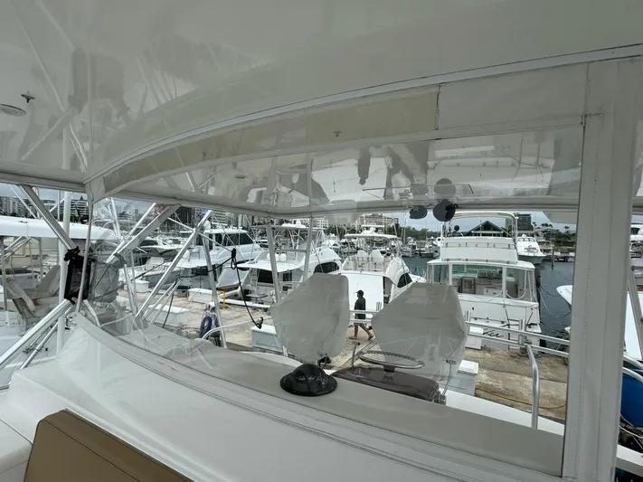  Yacht Photos Pics 2010 Viking 54 Convertible yacht docked at a marina, view from the helm.