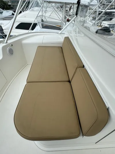  Yacht Photos Pics 2010 Viking 54 Convertible boat with tan cushioned seating area
