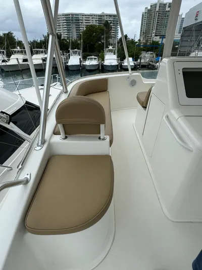  Yacht Photos Pics 2010 Viking 54 Convertible yacht with beige seating at a marina.