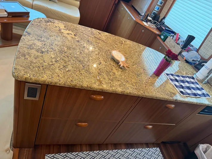  Yacht Photos Pics Granite countertop in the kitchen of a 2010 Viking 54 Convertible yacht.