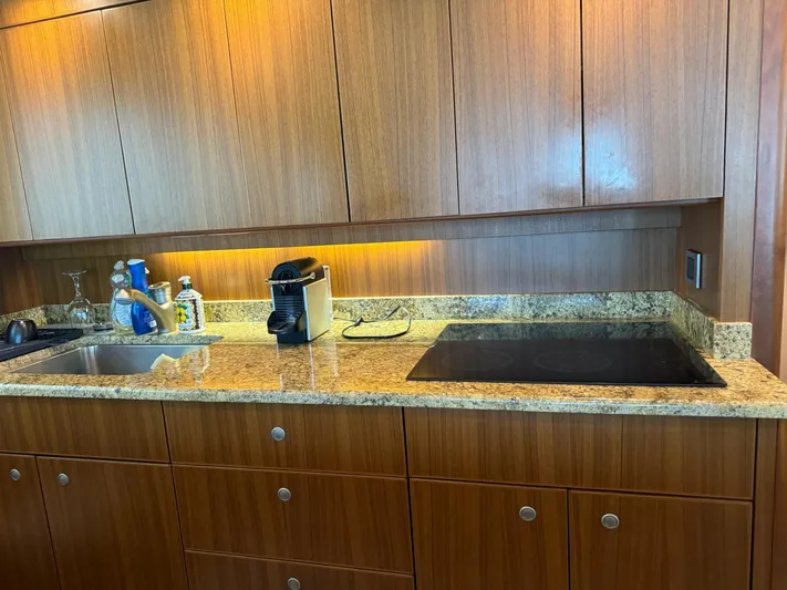  Yacht Photos Pics Modern kitchen in a 2010 Viking 54 Convertible yacht with granite countertops.