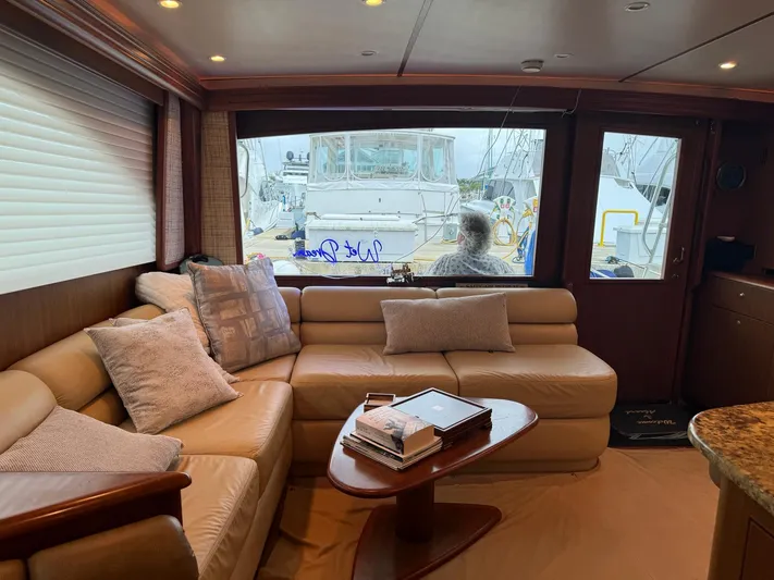  Yacht Photos Pics Luxurious interior of a 2010 Viking 54 Convertible yacht with leather seating and marina view.