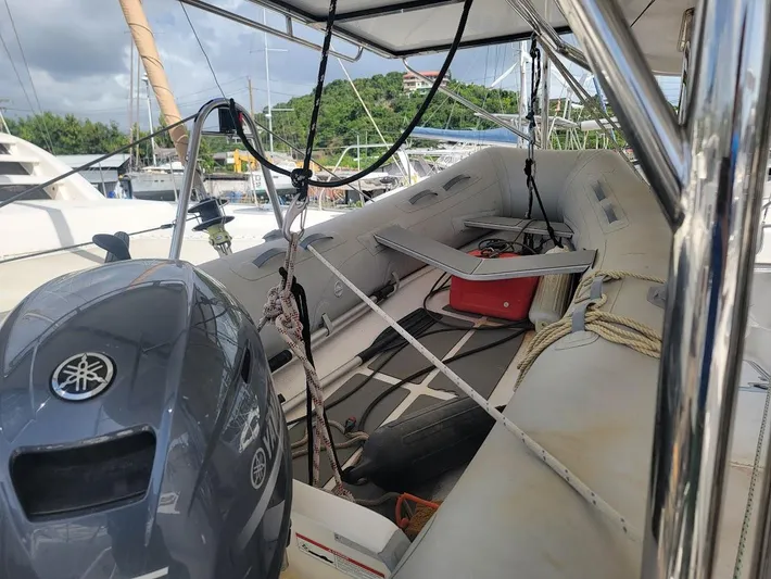 Kitten Caboodle Yacht Photos Pics Inflatable boat on Leopard 44 catamaran, 2015 model, docked at marina with Yamaha outboard motor.