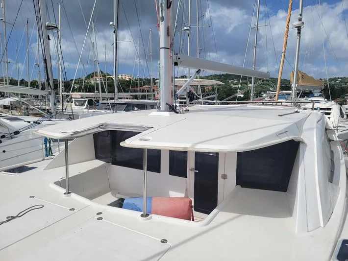 Kitten Caboodle Yacht Photos Pics 2015 Leopard 44 catamaran docked at marina, featuring spacious deck and modern design.