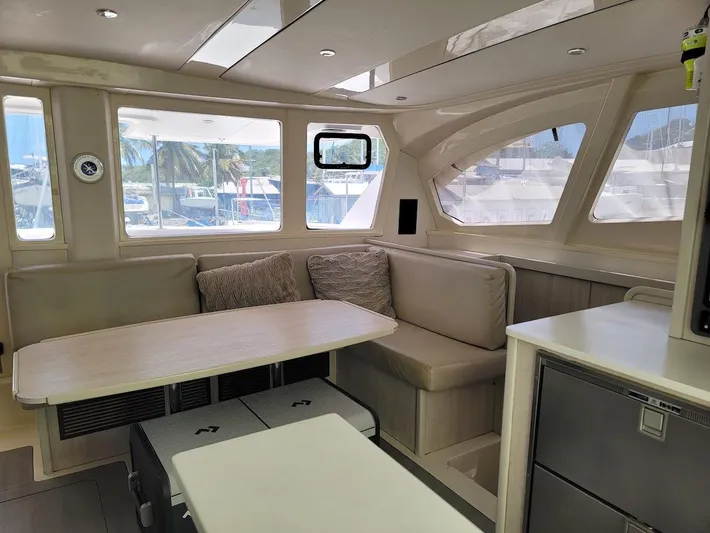 Kitten Caboodle Yacht Photos Pics Interior of 2015 Leopard 44 catamaran with modern seating and large windows.