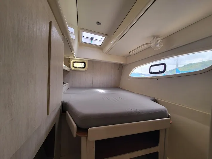 Kitten Caboodle Yacht Photos Pics Cozy cabin interior of 2015 Leopard 44 yacht with bed and windows.