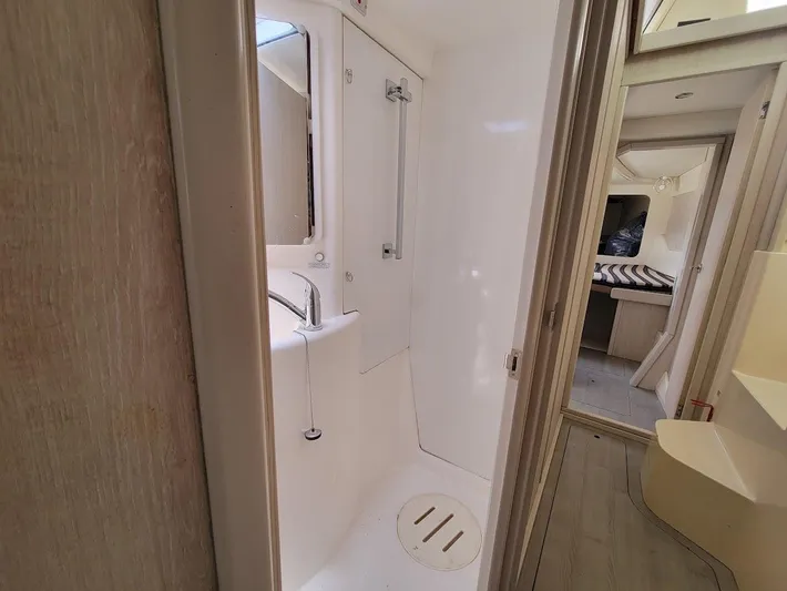 Kitten Caboodle Yacht Photos Pics Compact bathroom in 2015 Leopard 44 yacht, featuring shower and sink.