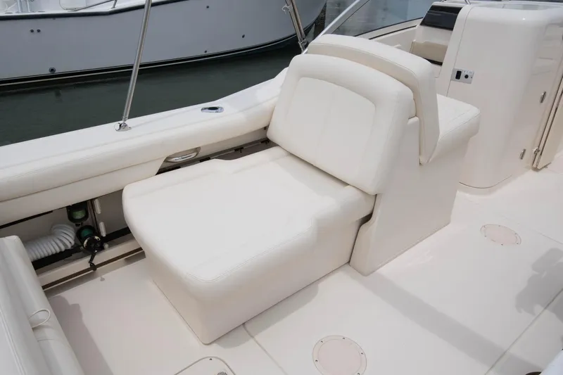  Yacht Photos Pics 2026 Grady-White GW 235 Freedom boat interior with white seating and sleek design.