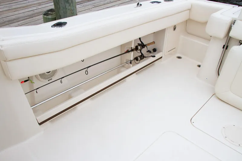  Yacht Photos Pics 2026 Grady-White GW 235 Freedom boat interior with rod storage and seating.