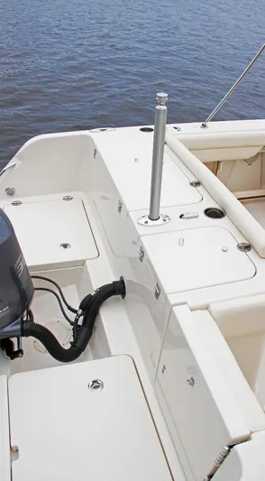  Yacht Photos Pics 2026 Grady-White GW 235 Freedom boat deck with motor, rod holder, and storage compartments.