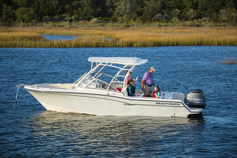  Yacht Photos Pics 2026 Grady-White GW 235 Freedom boat on water with passengers enjoying a sunny day.