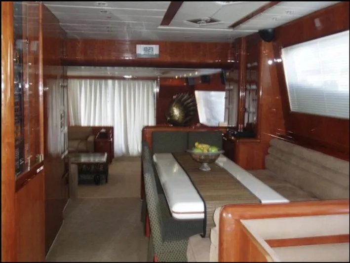  Yacht Photos Pics Luxurious 1993 Tecnomarine yacht interior with elegant dining area and plush seating.