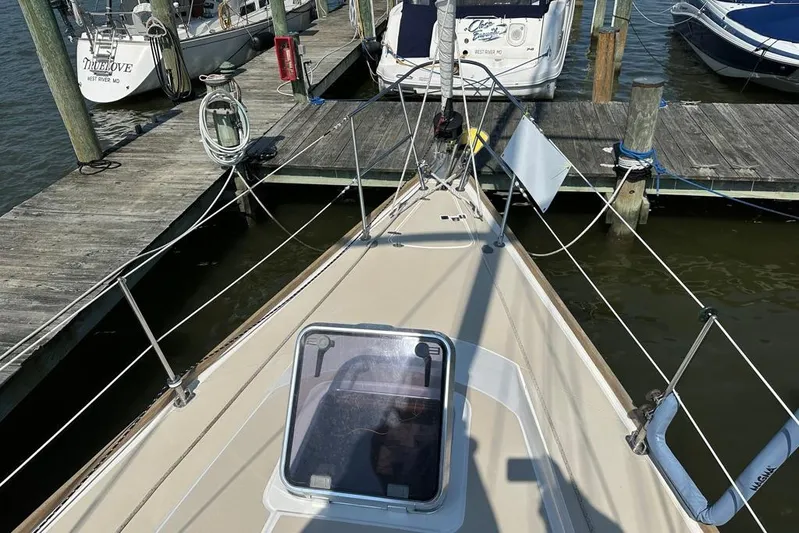  Yacht Photos Pics Bow view of a 2002 Sabre 402 sailboat docked at a marina.