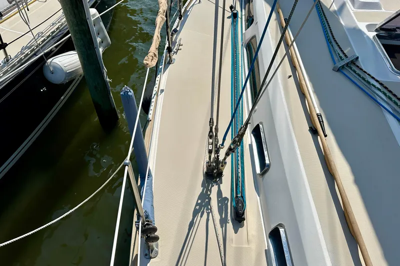  Yacht Photos Pics Deck view of a 2002 Sabre 402 sailboat with rigging and dock.