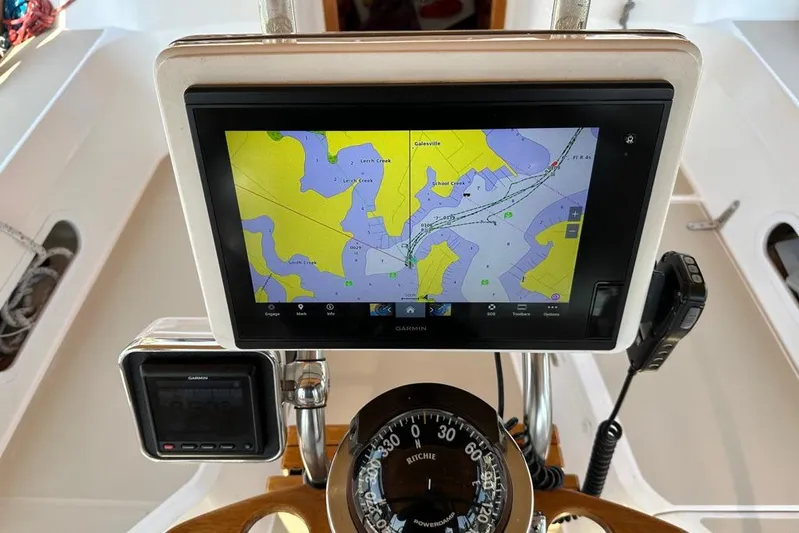  Yacht Photos Pics Navigation system on a 2002 Sabre 402 sailboat, featuring a Garmin display and compass.