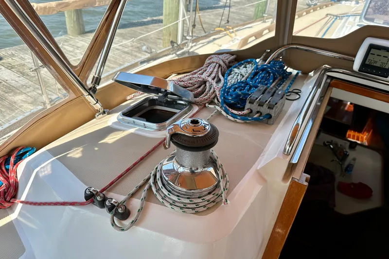  Yacht Photos Pics Deck of 2002 Sabre 402 sailboat with winch, ropes, and navigation equipment.