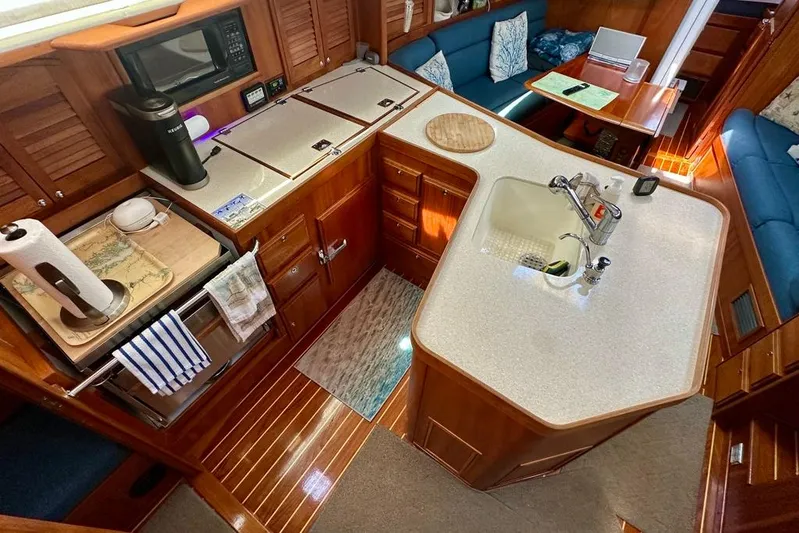  Yacht Photos Pics Luxurious 2002 Sabre 402 yacht interior with modern kitchen and cozy seating area.
