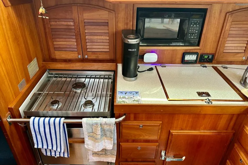  Yacht Photos Pics Galley kitchen in 2002 Sabre 402 yacht with stove, microwave, and Keurig.