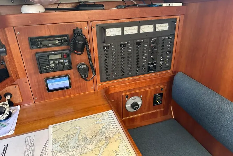  Yacht Photos Pics Navigation station on a 2002 Sabre 402 sailboat with control panels and map.