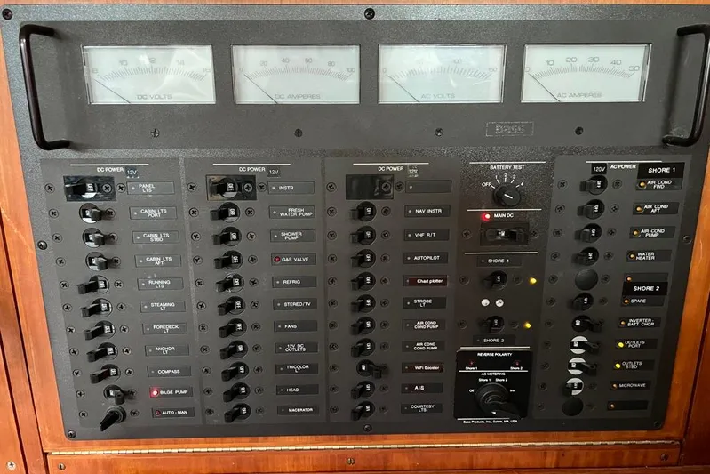  Yacht Photos Pics Electrical control panel of a 2002 Sabre 402 boat, featuring various switches and gauges.