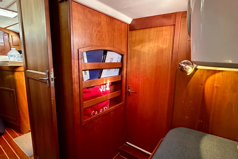  Yacht Photos Pics Interior of 2002 Sabre 402 sailboat with wooden cabinetry and cozy lighting.