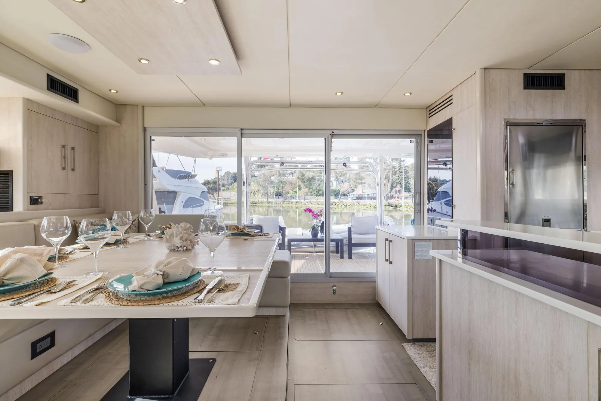 Luxurious dining area on 2015 Leopard 58 yacht with elegant table setting.