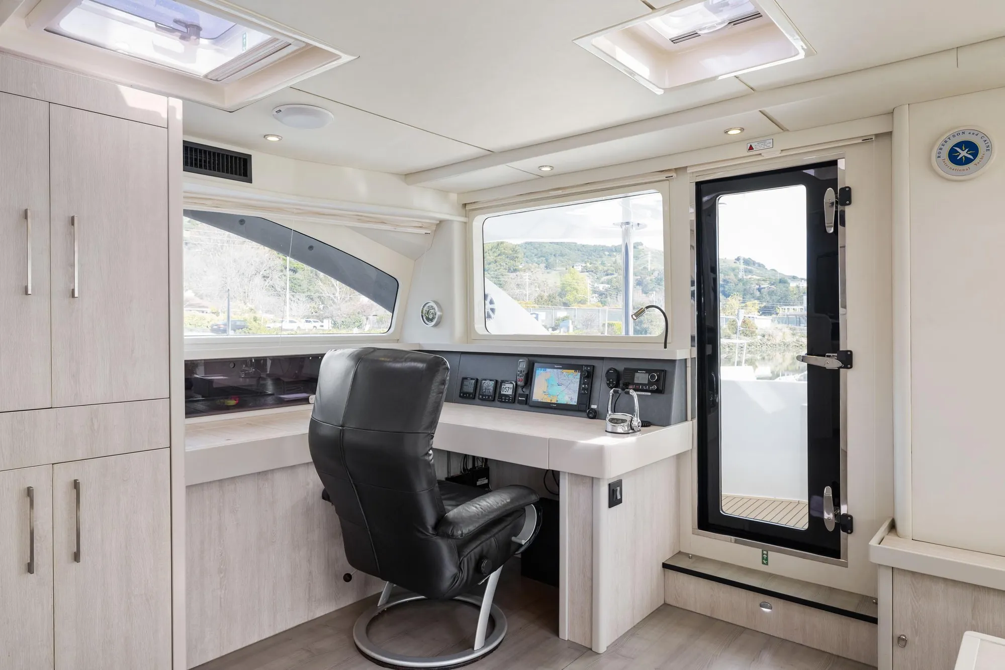 Luxurious 2015 Leopard 58 yacht interior with navigation station and modern design.
