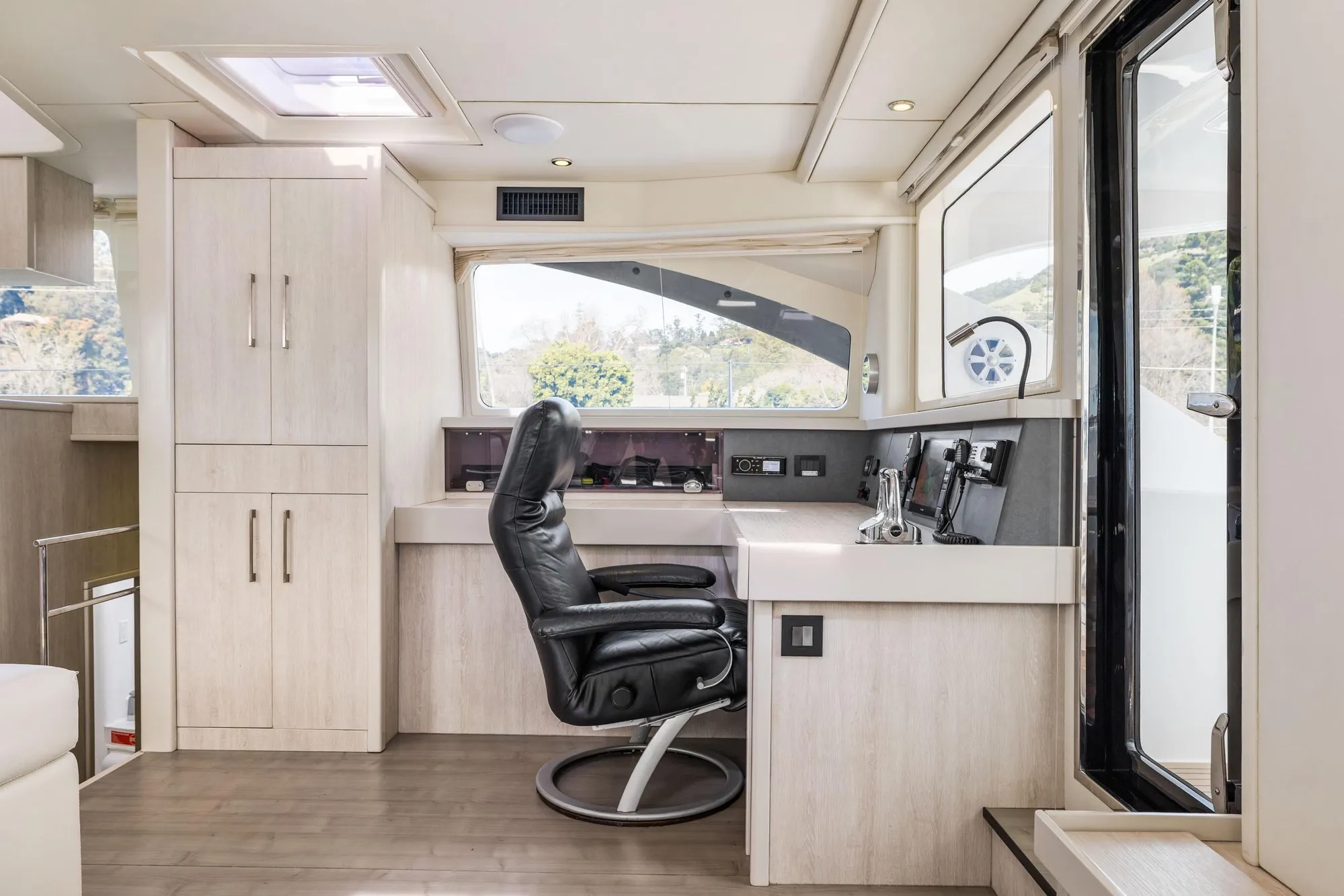 Luxurious Leopard 58 yacht interior with modern helm station and comfortable seating, 2015 model.