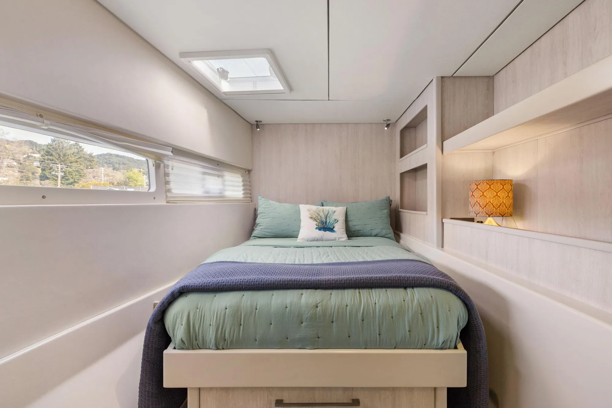 Luxurious bedroom interior of 2015 Leopard 58 yacht with cozy bedding and elegant decor.