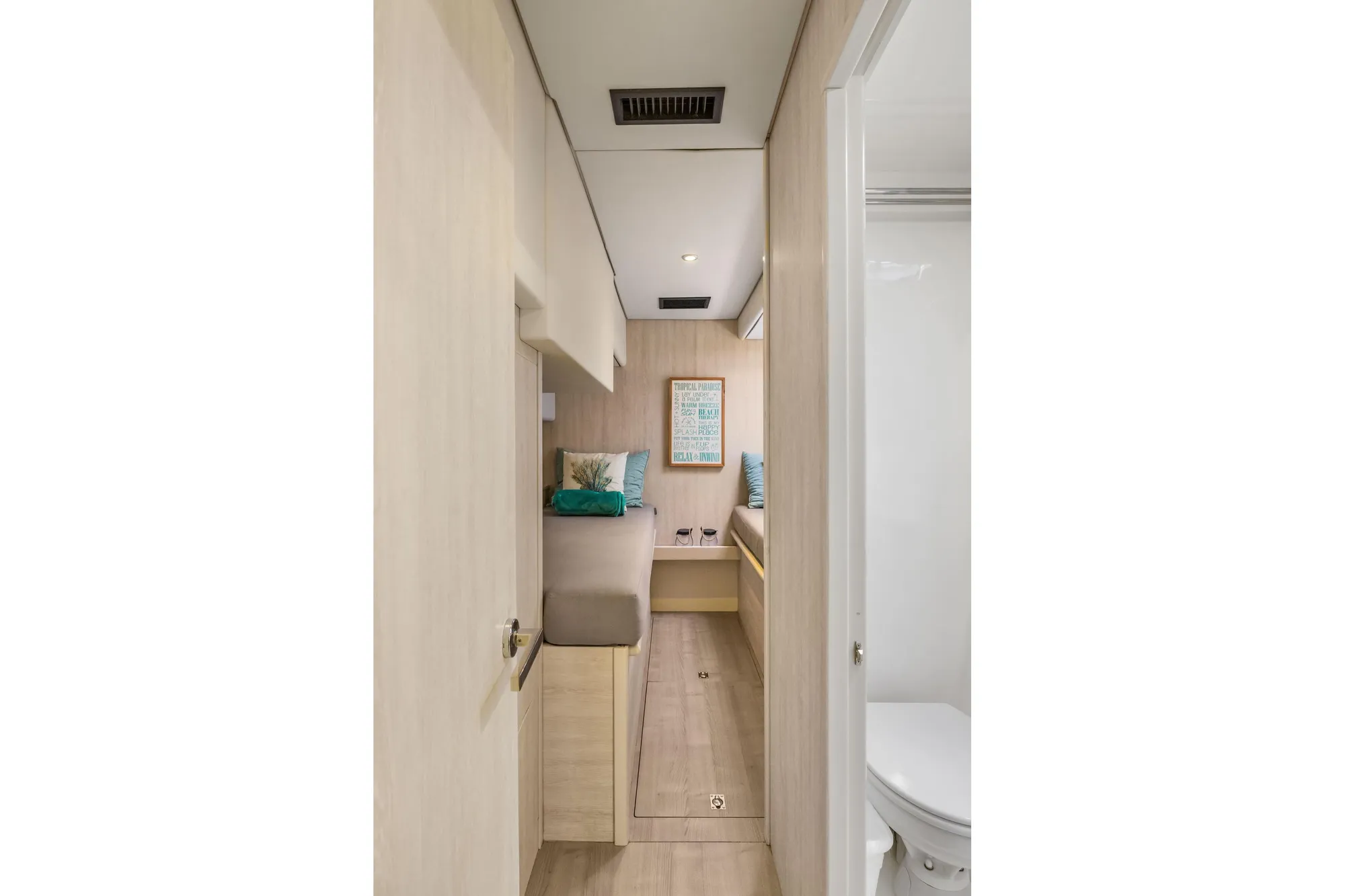 Interior of 2015 Leopard 58 yacht with cozy cabin and modern bathroom.