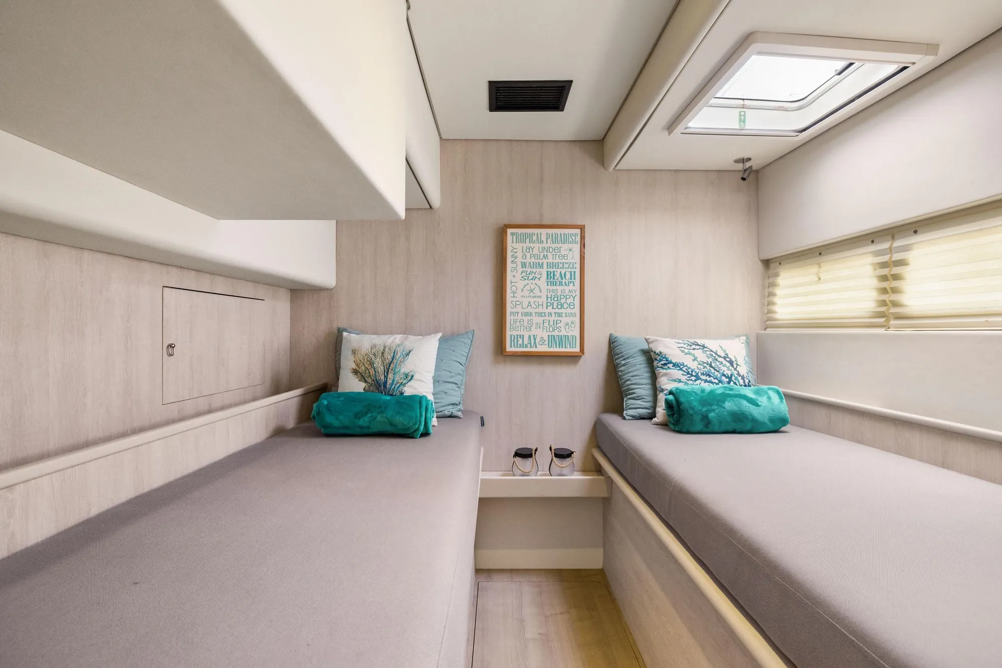 Luxurious 2015 Leopard 58 yacht cabin with twin beds and modern decor.