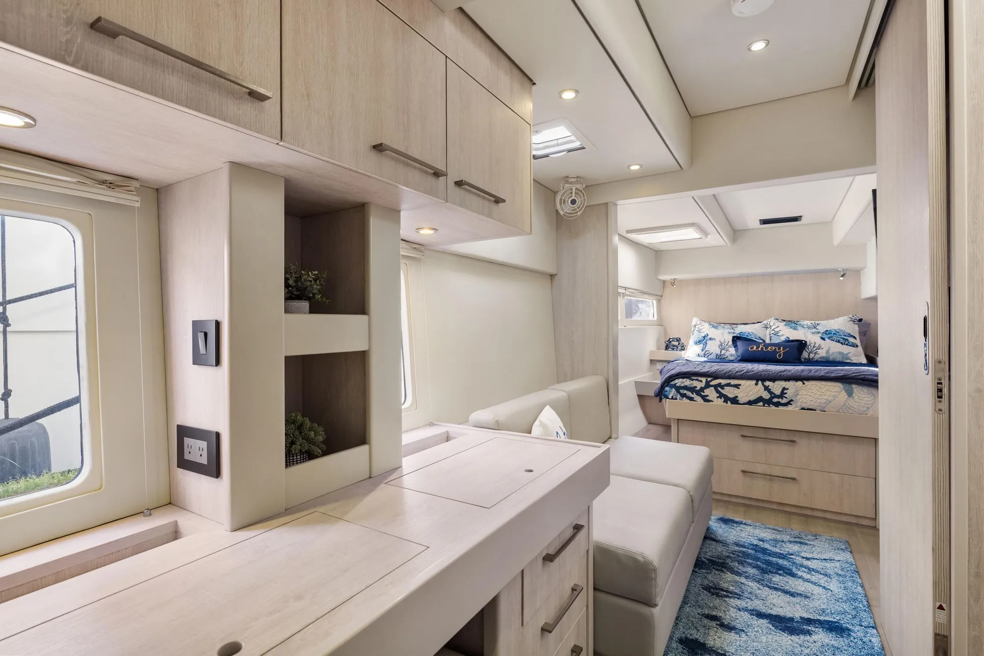 Luxurious interior of 2015 Leopard 58 yacht with modern furnishings and cozy bedroom.