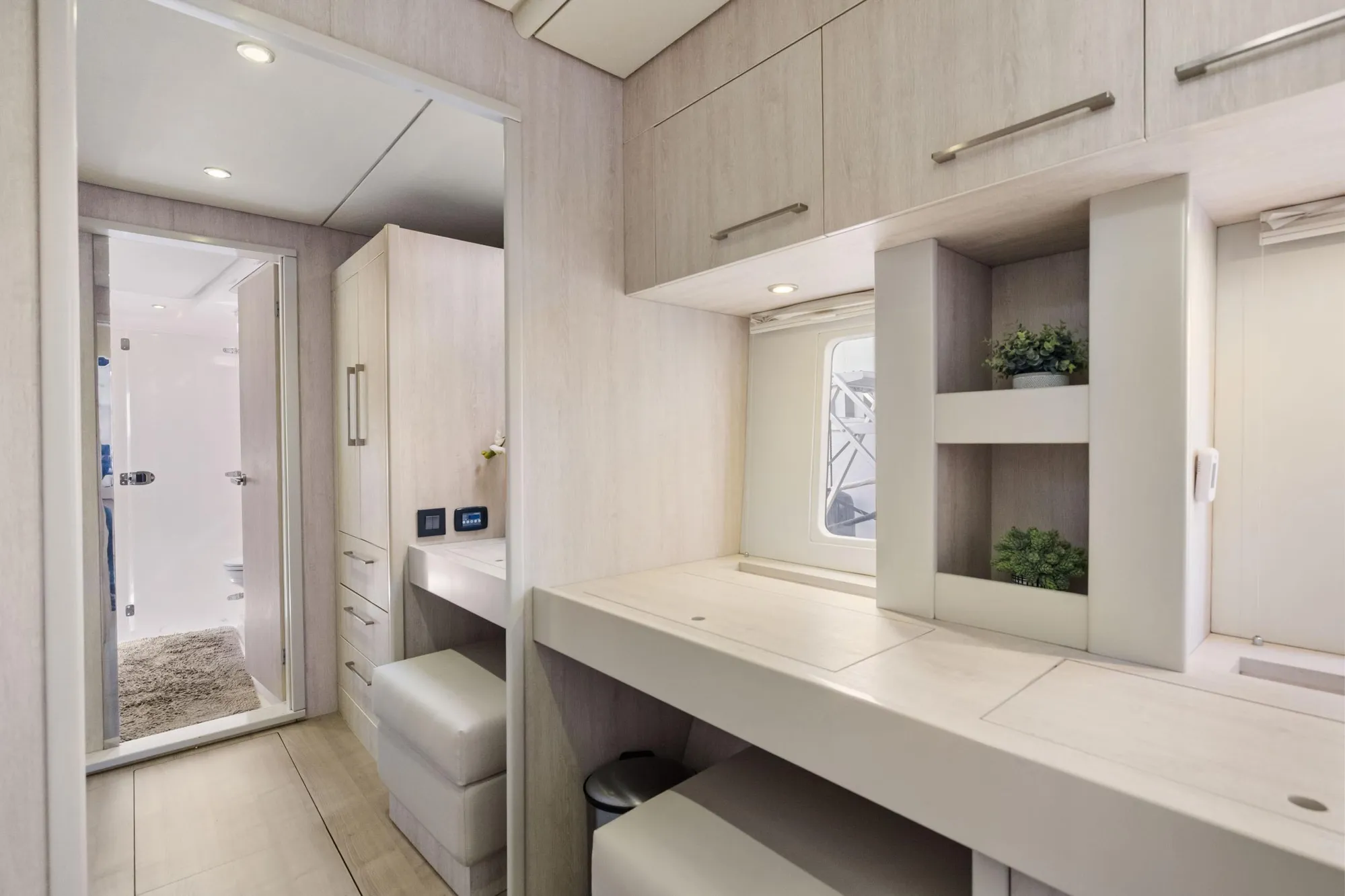 Luxurious interior of 2015 Leopard 58 yacht with modern cabinetry and elegant decor.