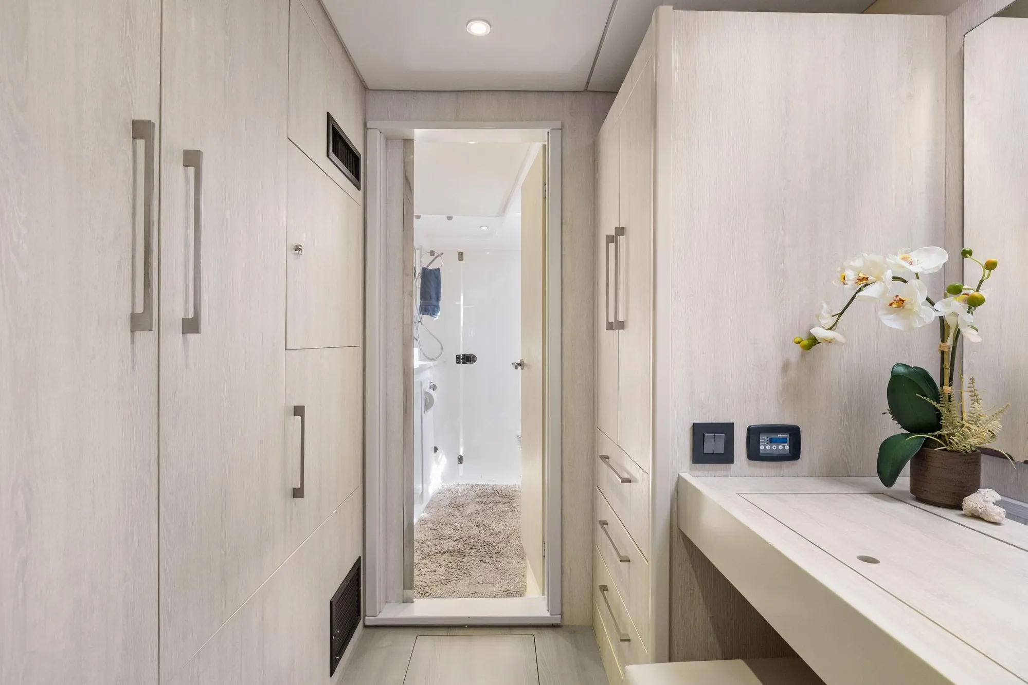 Luxurious interior of 2015 Leopard 58 yacht with modern cabinetry and elegant decor.