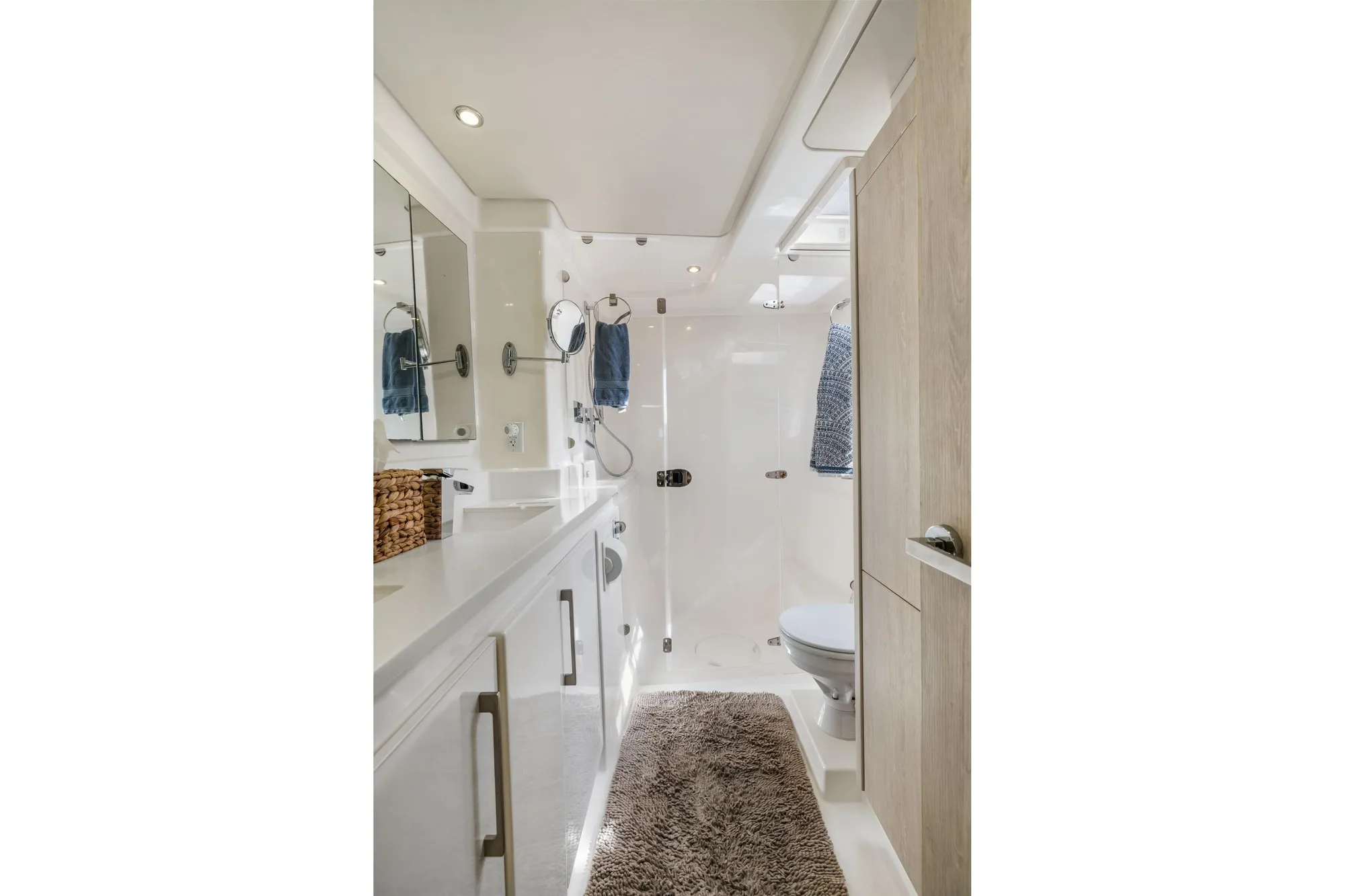 Luxurious bathroom interior of 2015 Leopard 58 yacht, featuring modern fixtures and elegant design.