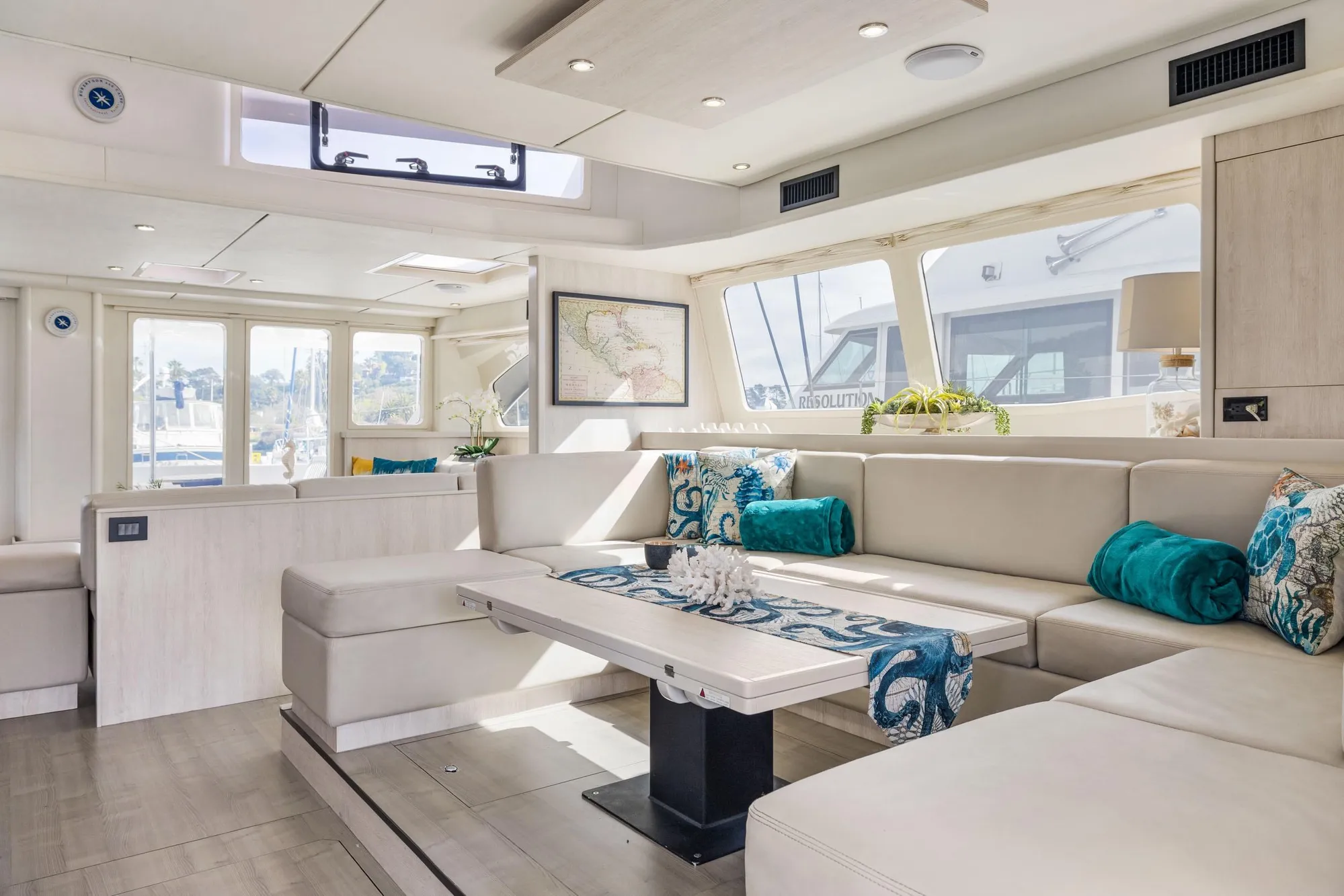 Luxurious interior of 2015 Leopard 58 yacht with elegant seating and decor.