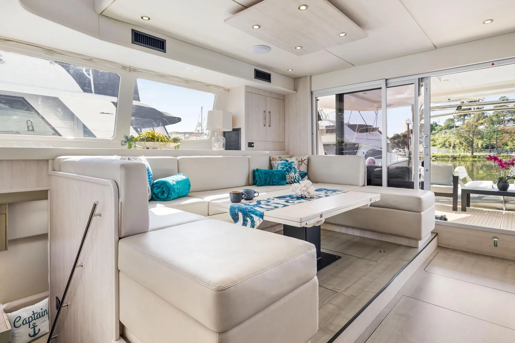 Luxurious interior of 2015 Leopard 58 yacht with elegant seating and modern decor.