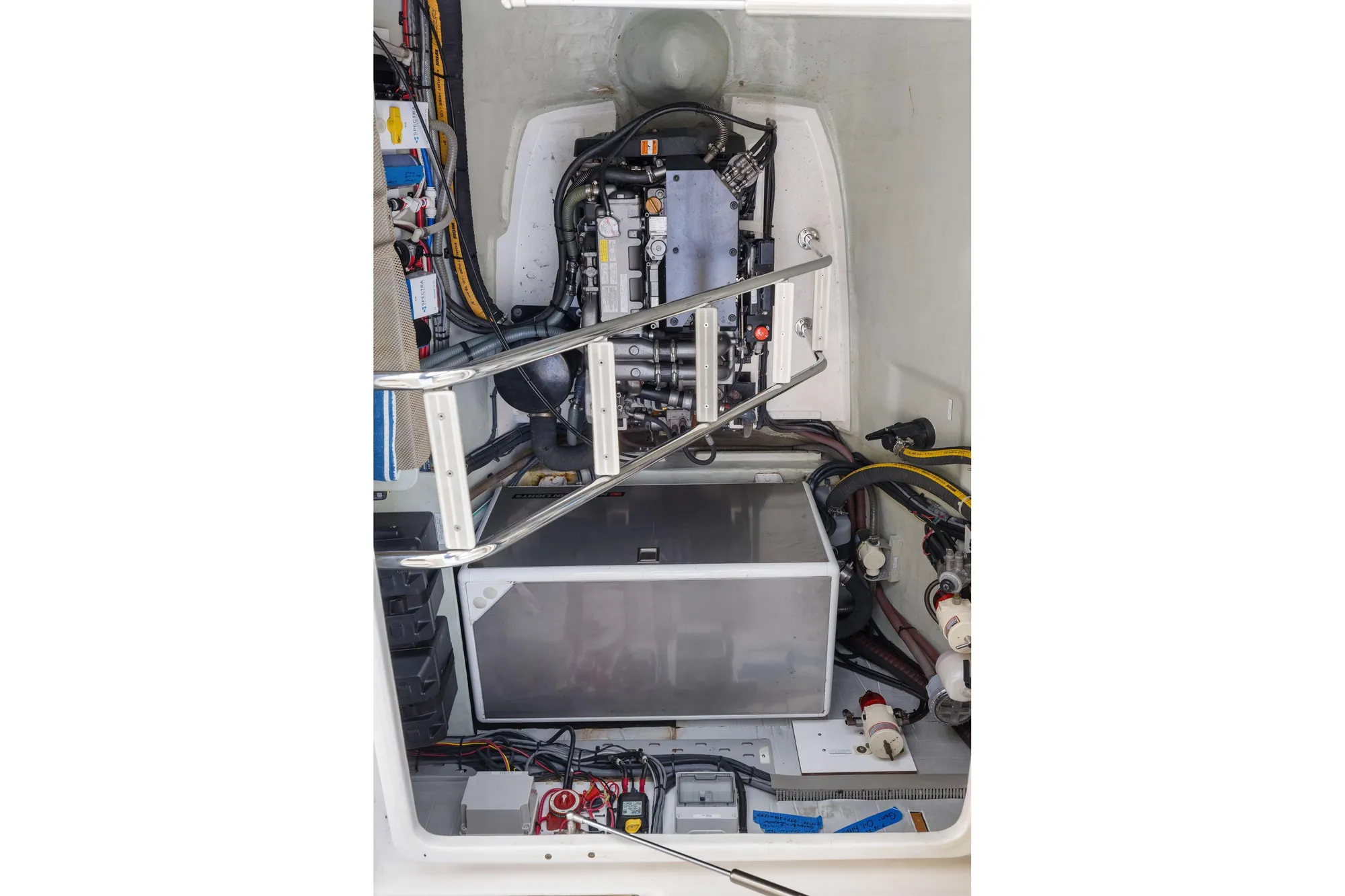 Engine compartment of a 2015 Leopard 58 yacht, showcasing mechanical components and wiring.