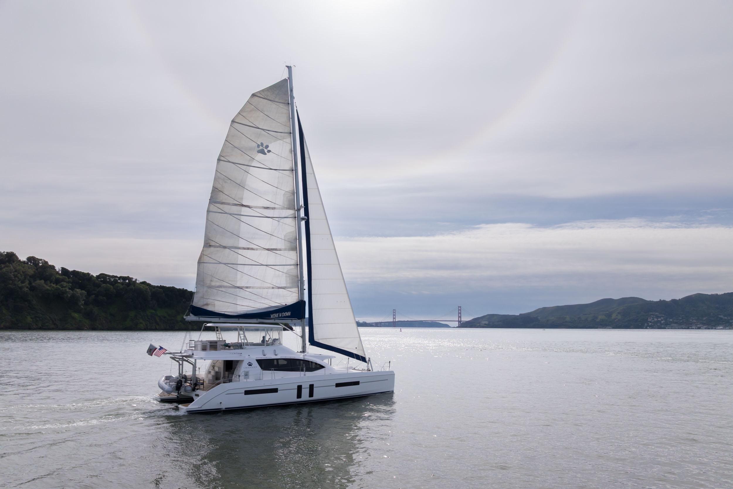 Sailing catamaran Leopard 58, 2015 model, cruising near Golden Gate Bridge.
