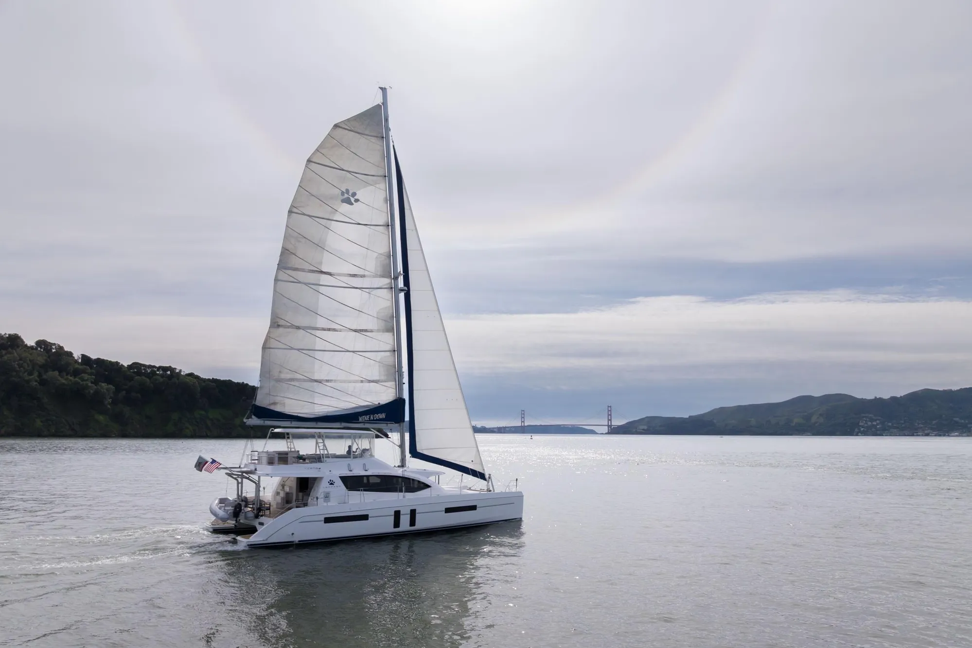 Sailing catamaran Leopard 58, 2015 model, cruising near Golden Gate Bridge.